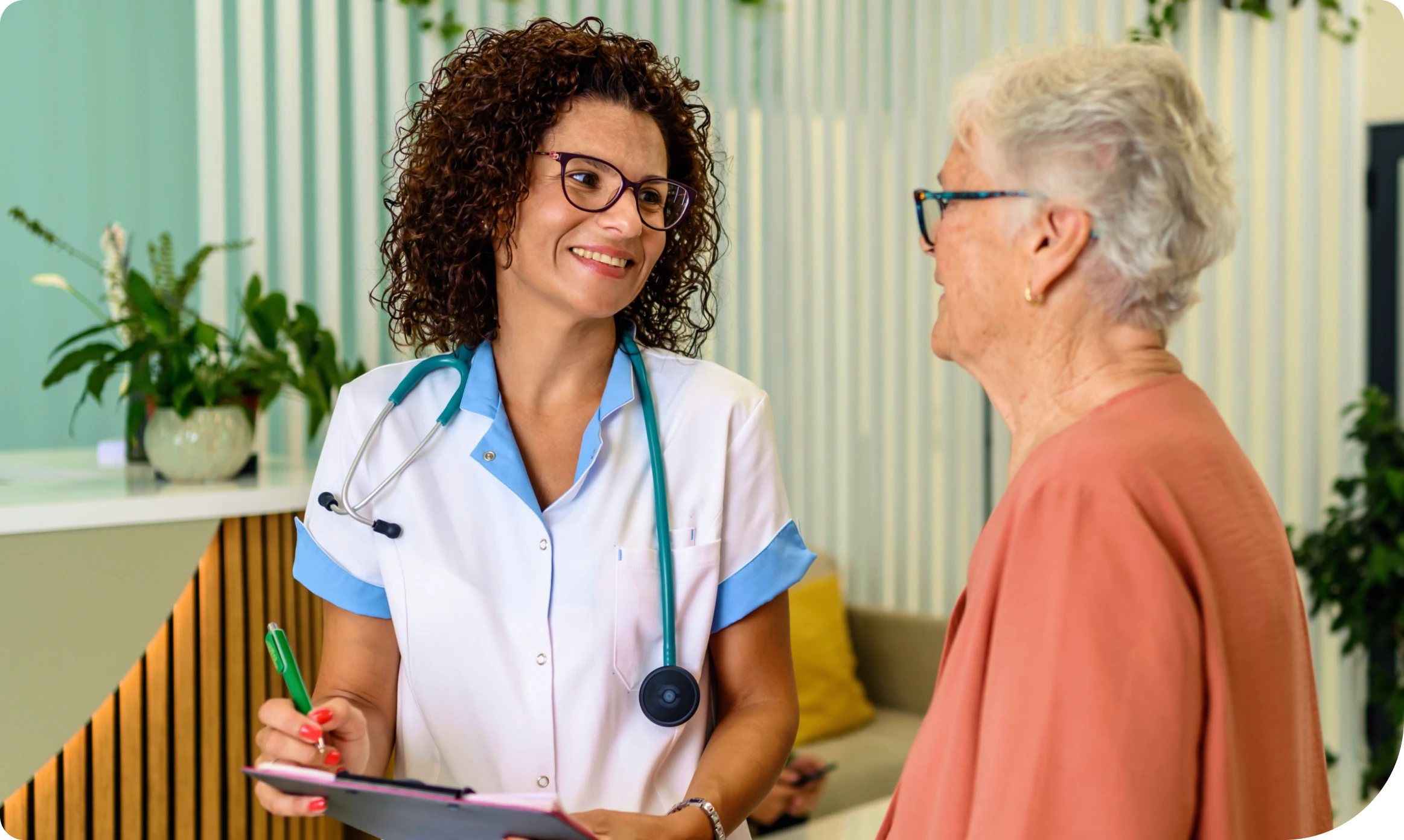 Healthcare professional with stethoscope and patient